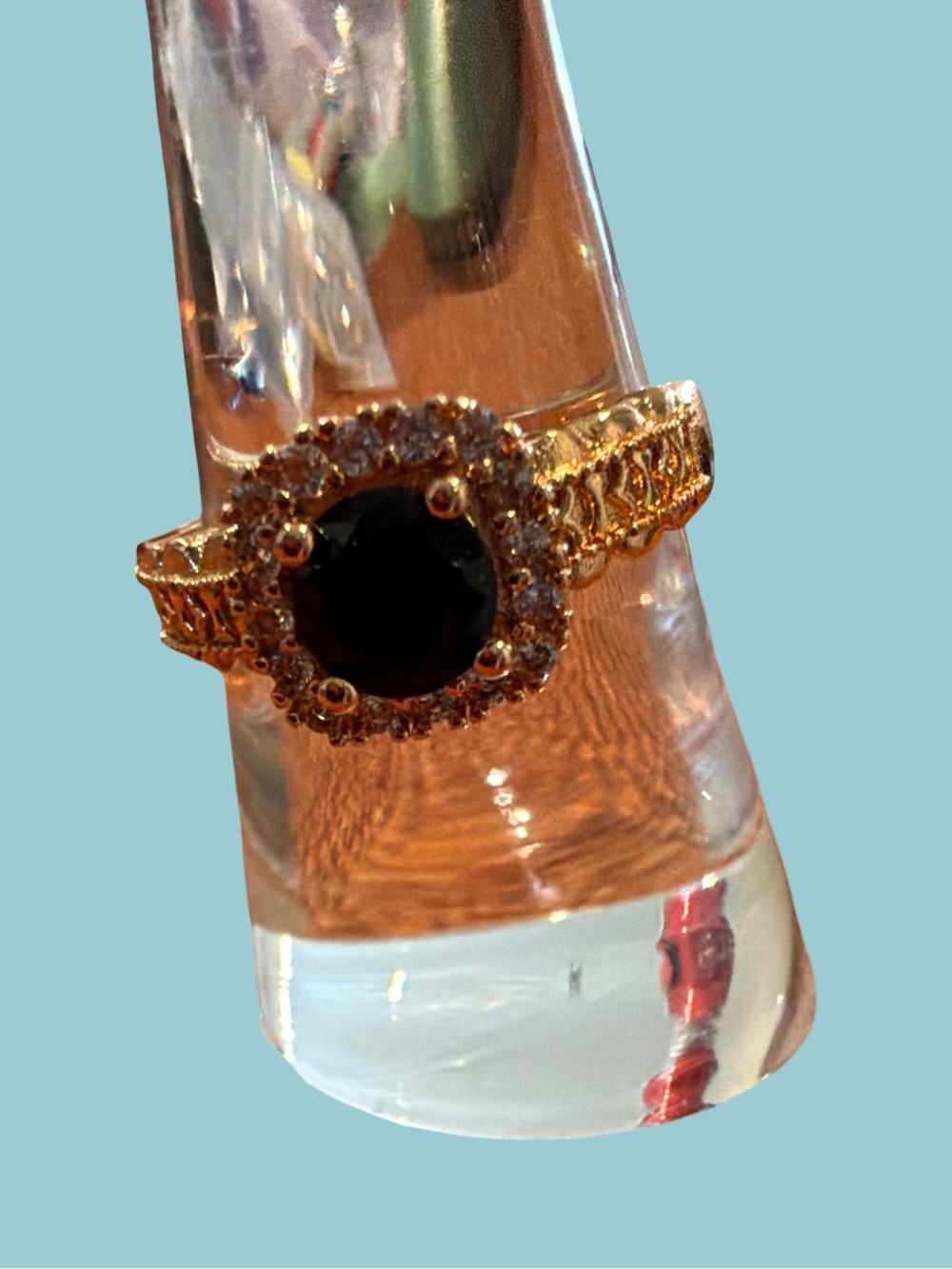 Gold Ring with Black Center Stone and Halo Accent